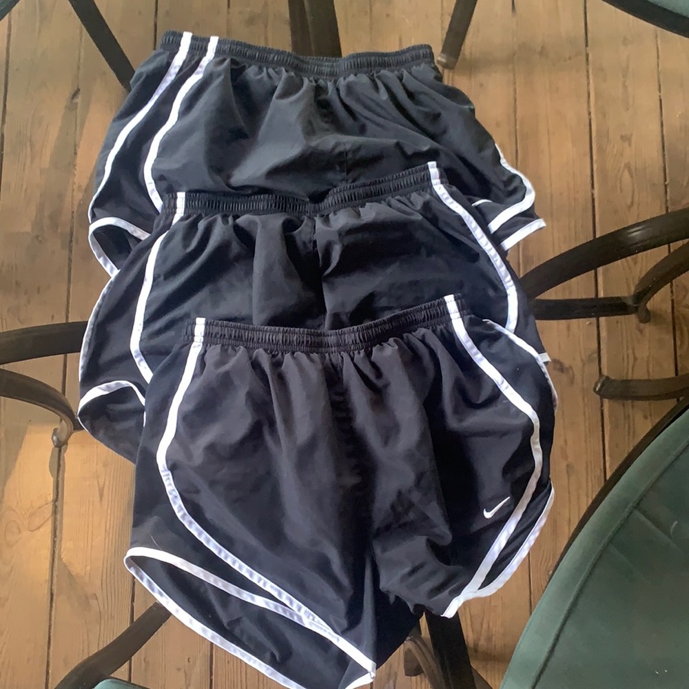 3 black Nike shorts